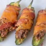  With only ONE net carb and 18g fat, these cheesy bacon-wrapped Low Carb, Keto Jalapeño Poppers are a keto-dieter's dream. They require only 8 ingredients and half an hour. Gluten-free, grain-free with a dairy-free, Whole30 and Paleo option too! The perfect finger food or appetizer!