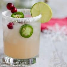 This Low Carb, Keto Spicy Cranberry Margarita is the perfect guilt-free holiday cocktail! Fresh cranberries and jalapeños add a special twist to the traditional margarita. Orange extract and a little water replace the traditional sugar-laden orange liqueur. | www.farmsteadchic.com #ketococktail #lowcarbcocktail #ketomargarita #lowcarbmargarita #spicymargarita #holidaymargarita #Christmascocktail